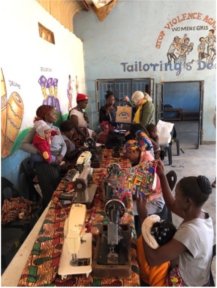 Womens sewing group working on sewing machines