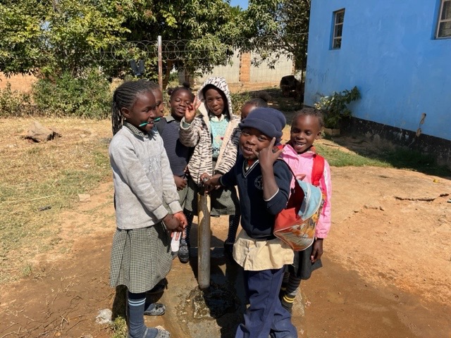 Children at the borehole pump